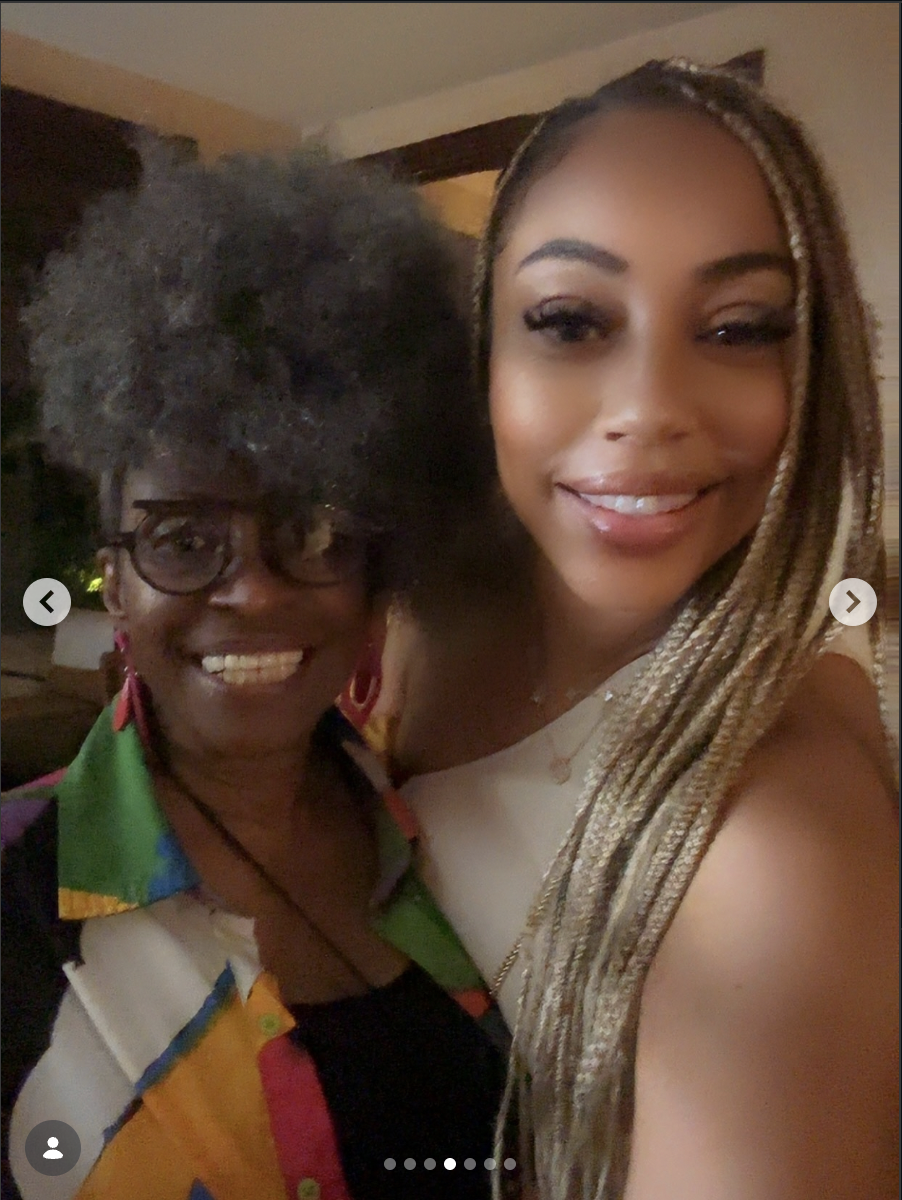 Shazz with a client wearing long blonde braids